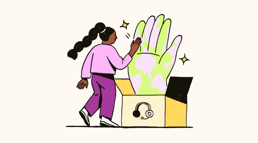 A woman giving a high-five to a big hand jumping out of the box.