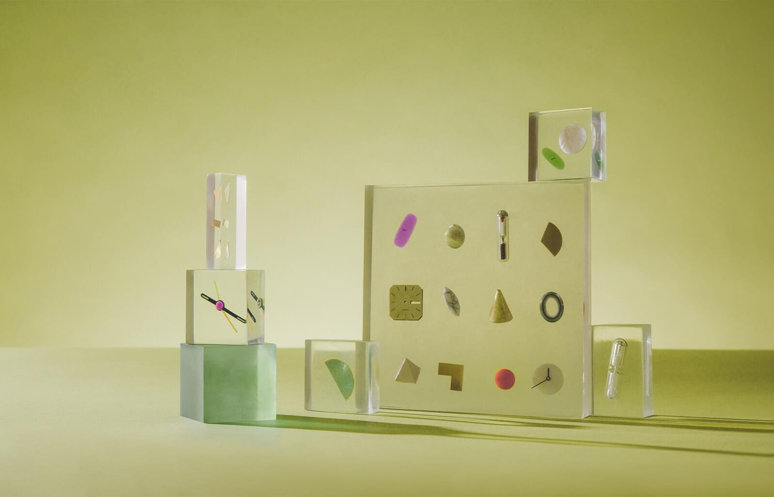 An image depicts a collection of miscellaneous objects suspended in a clear block.