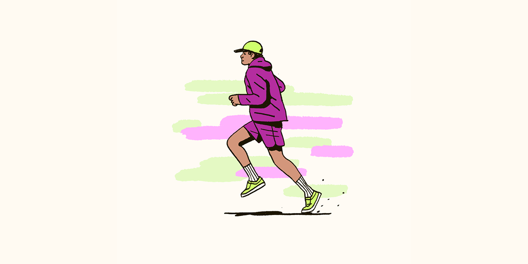 A person is running in a purple hoodie and track shorts