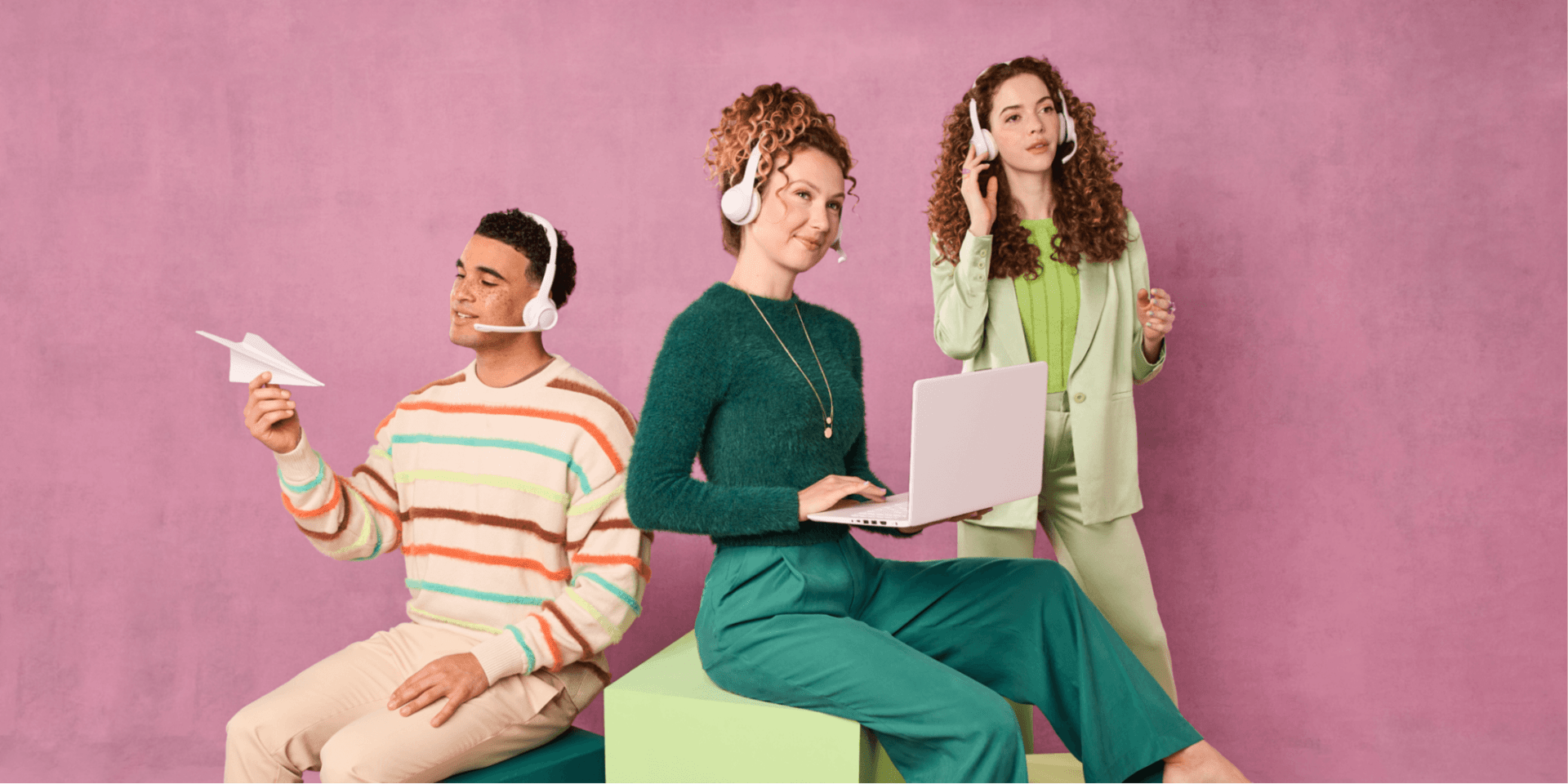 Three people with headsets provide customer support.