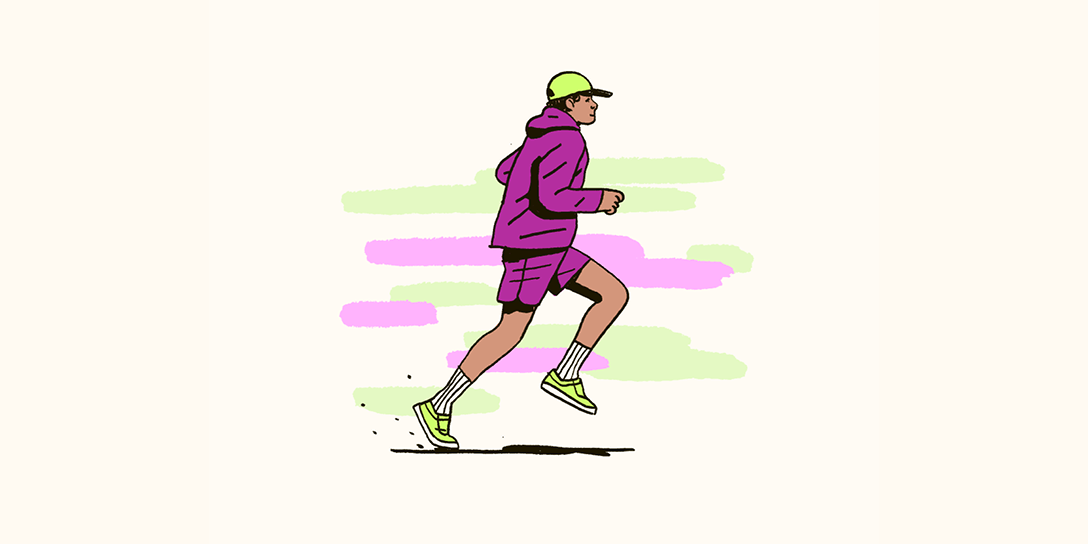 A man runs in purple and green clothing.