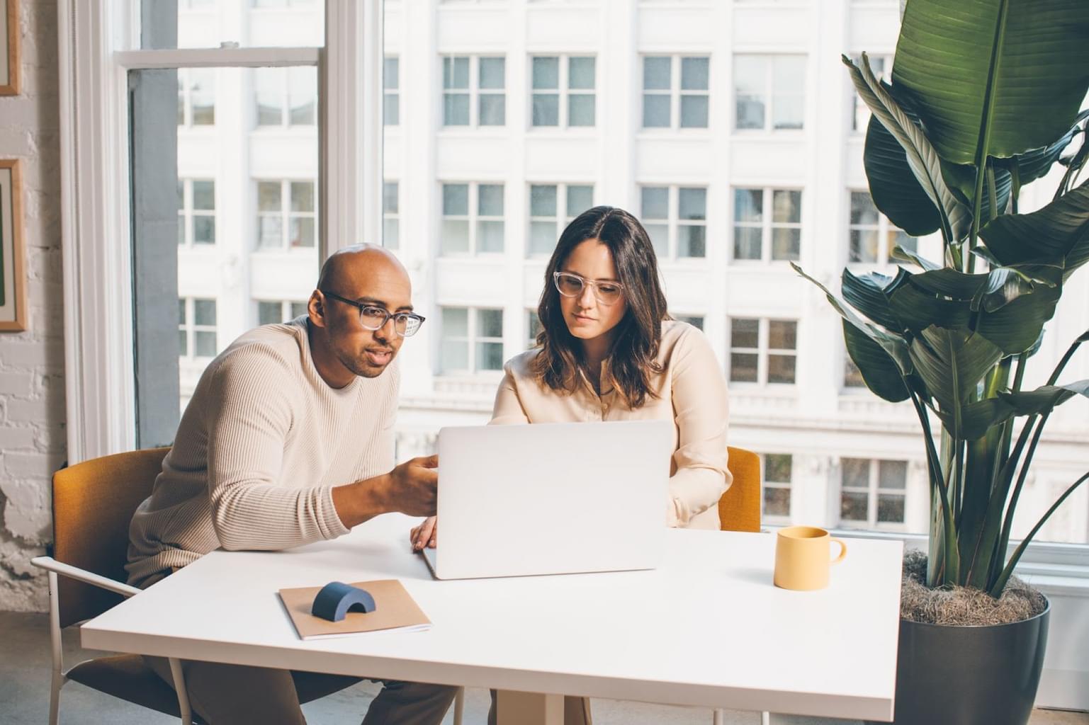 A man and woman research their customer base to find out how they can find their product-market fit. 