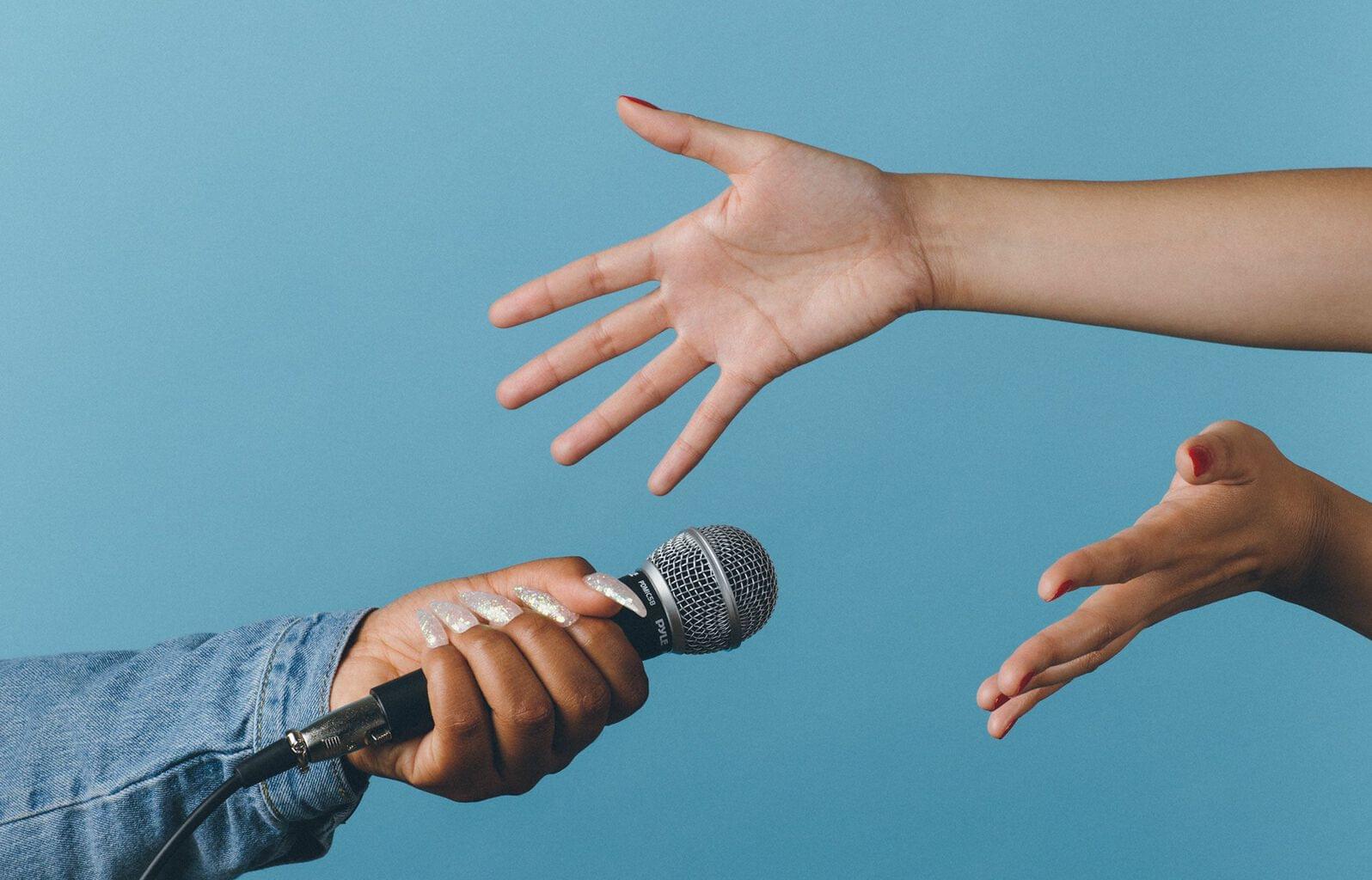 Transactional vs. consultative selling, speaking into microphone