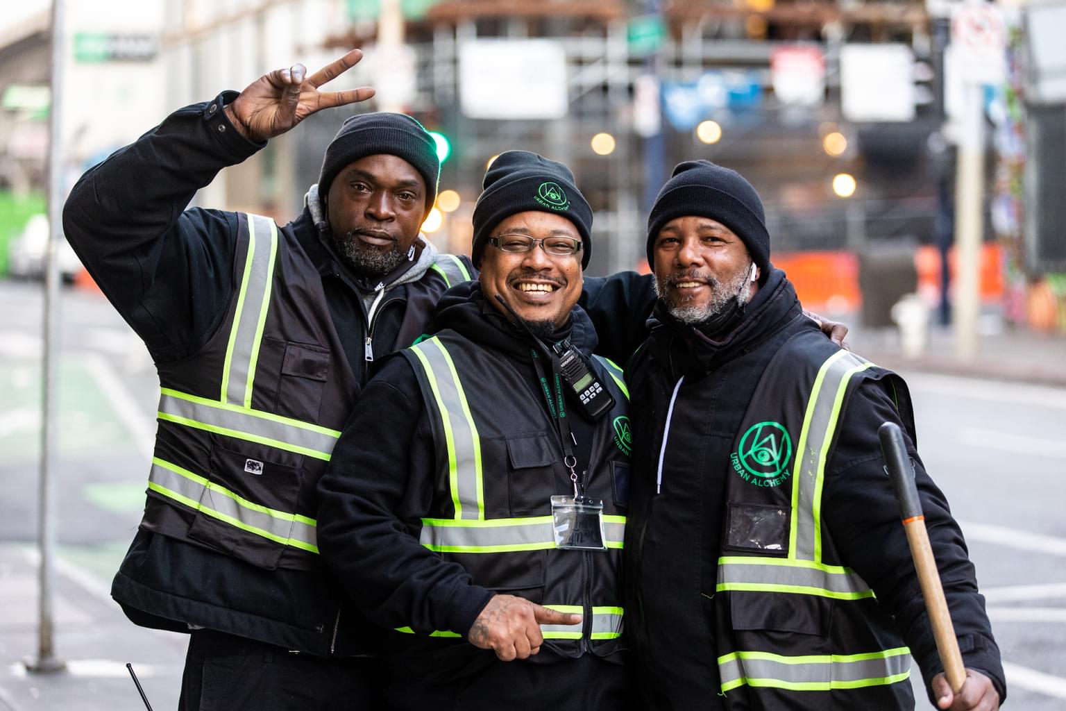 Urban Alchemy employees help with street cleaning