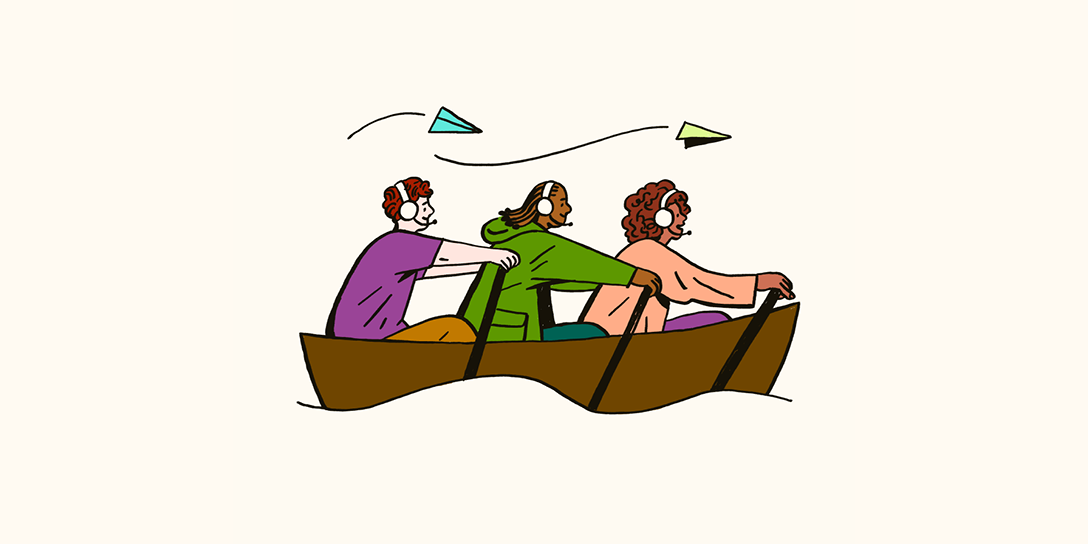 Three young professionals sit in a rowboat with headsets.