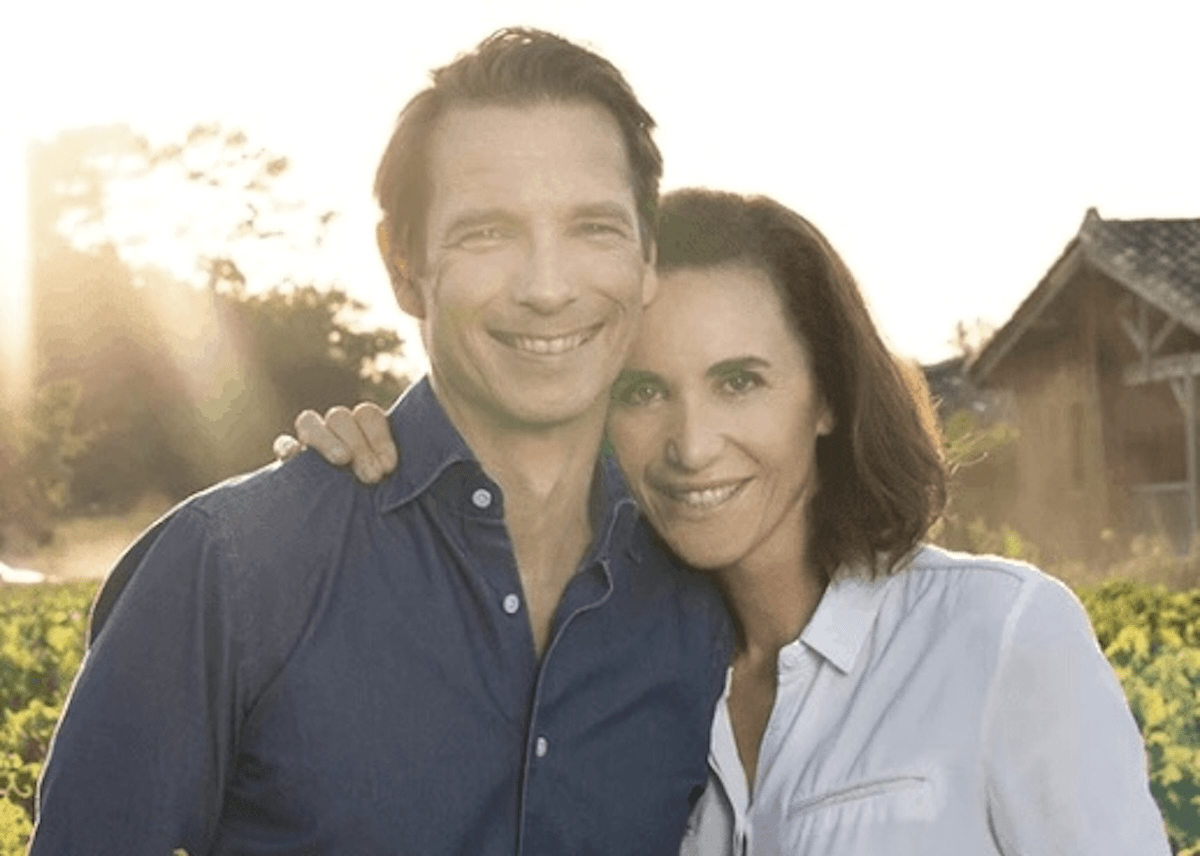 Happy couple in a French field during golden hour