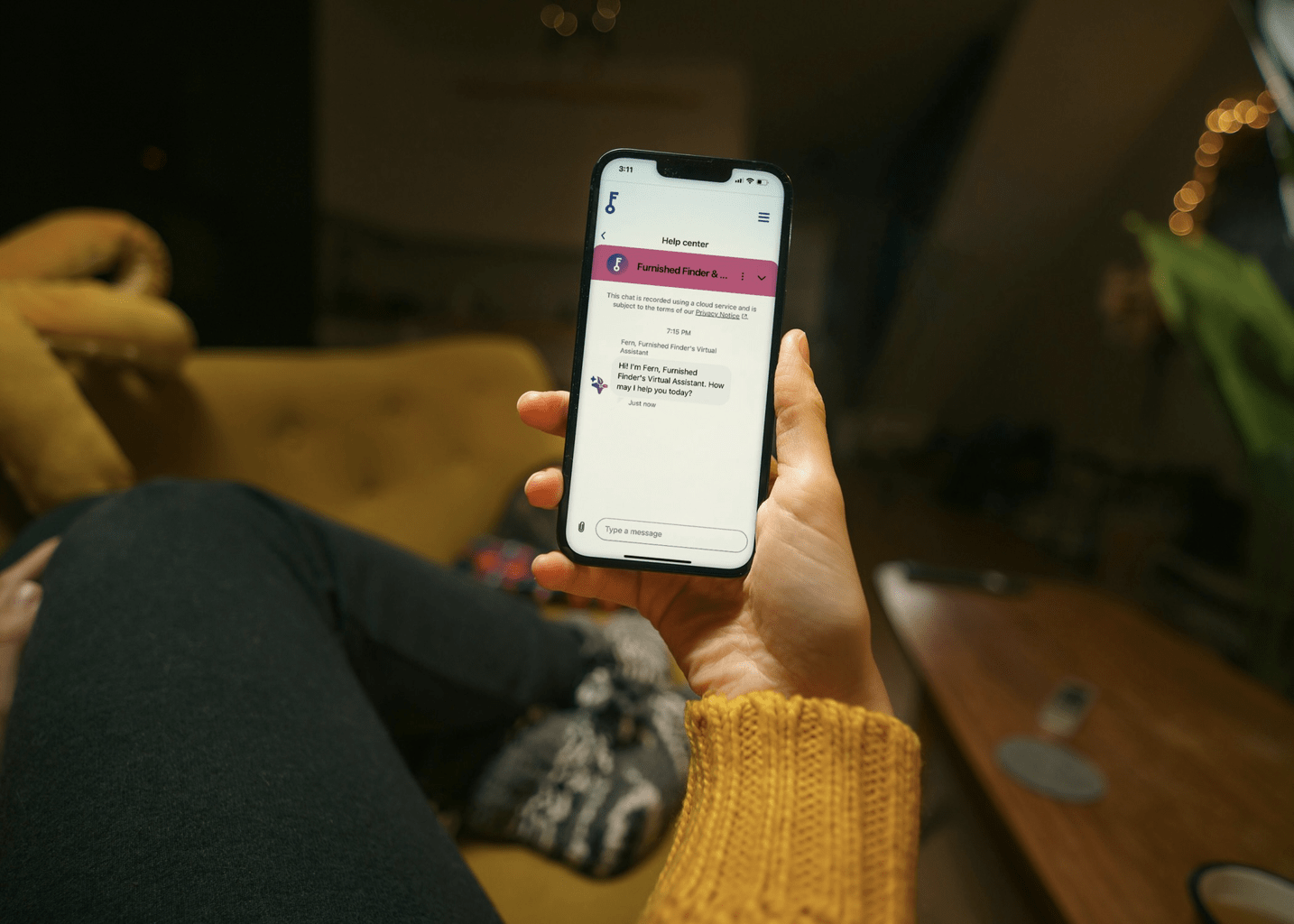 Close-up of someone scrolling through the Furnished Finder app on their mobile phone
