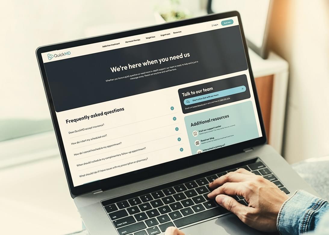 A laptop open to QuickMD, with the headline, 'We're here when you need us.'