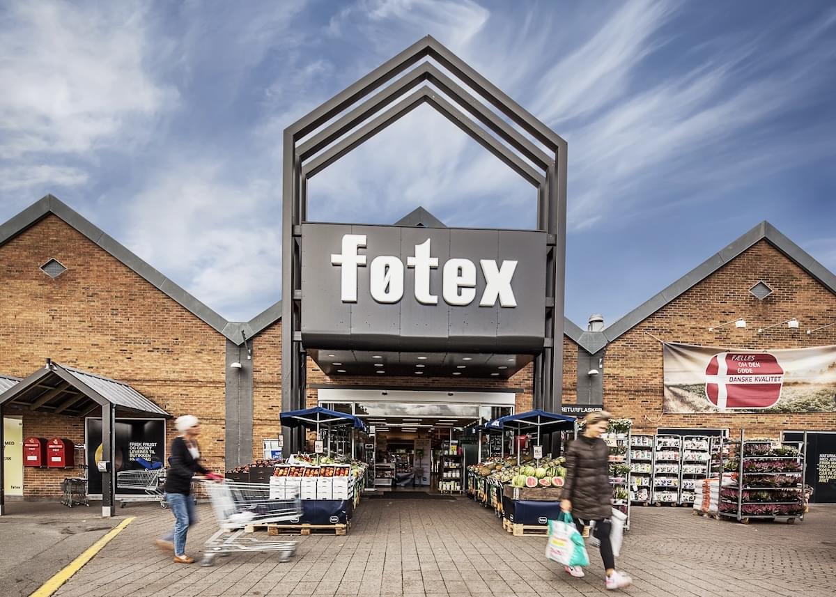 Exterior of Føtex with two shoppers blurred in the foreground
