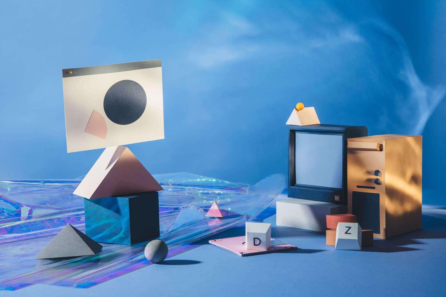 An assortment of objects representing cloud companies, such as a computer tower and television with smaller objects surrounding