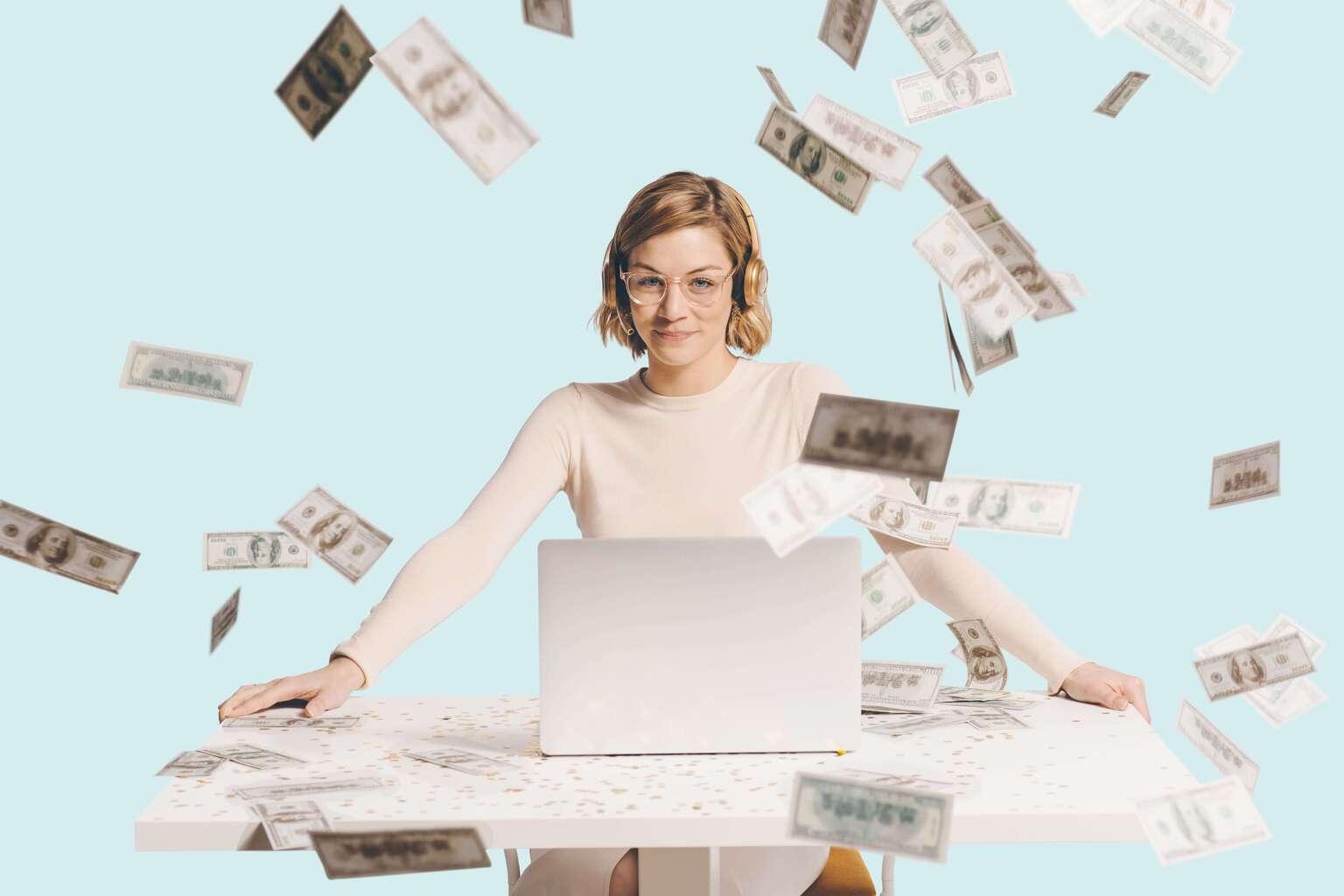 Woman wearing a headset sitting at a desk with dollar bills raining down all around her demonstrating how increasing net retention will make you more money